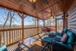 Screened-In Porch with Comfortable Seating and Outdoor Dining Table